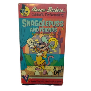 May include: A VHS video cassette featuring a Hanna-Barbera Command Performance cartoon with Snagglepuss and Friends. The cover features a cartoon image of Snagglepuss in a theatrical costume holding a skull, with the title "Snagglepuss and Friends: Express Trained Lion" and the text "A Hanna-Barbera Mystery Cartoon!"