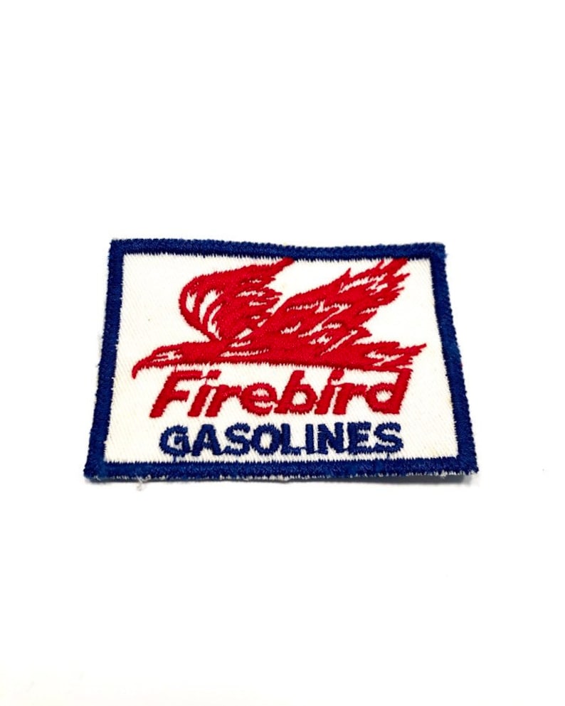 May include: Red and blue embroidered patch with a red bird in flight and the text "Firebird Gasolines".