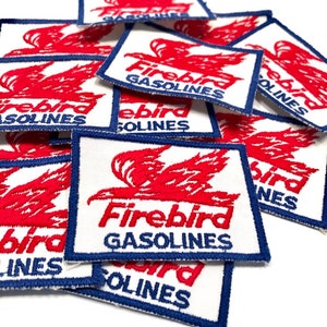 May include: A stack of white fabric patches with red and blue embroidery. The patches feature a stylized red bird with the text "Firebird Gasolines".