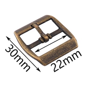 May include: Antique gold-toned metal buckle with a rectangular shape and a smooth, slightly textured surface. The buckle measures 30mm by 22mm.