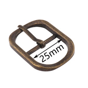 May include: Antique gold-toned metal buckle with a rounded rectangular shape. The buckle measures 25 mm in width.