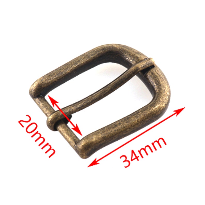 May include: Antique gold-tone metal belt buckle with a 34 mm by 20 mm size.