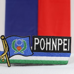 May include: A blue, white, and green embroidered patch with a flag of the Federated States of Micronesia and the word "POHNPEI" in white letters on a black background.
