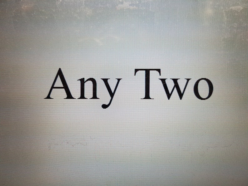 May include: The words "Any Two" are displayed in a black, serif font against a light gray background. The text is centered, with "Any" on the left and "Two" on the right.