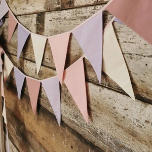 Wall decor will be great accessorie for kids party, baby shower and nursery. Bunting banner made of 100% pure cotton. Triangles are sewn double layer and are handmade. Old pink, violet, off white color. In one metre are 6 pieces of fabric flags.