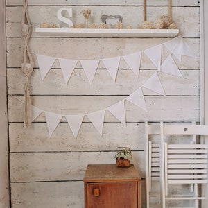 White cotton triangles bunting banner for baby shower or any festive. Large meters available