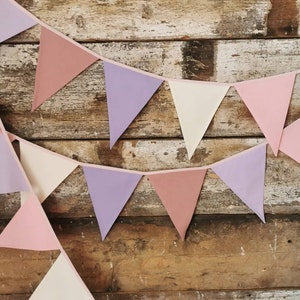 Wall decor will be great accessorie for kids party, baby shower and nursery. Bunting banner made of 100% pure cotton. Triangles are sewn double layer and are handmade. Old pink, violet, off white color. In one metre are 6 pieces of fabric flags.