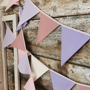 Wall decor will be great accessorie for kids party, baby shower and nursery. Bunting banner made of 100% pure cotton. Triangles are sewn double layer and are handmade. Old pink, violet, off white color. In one metre are 6 pieces of fabric flags.
