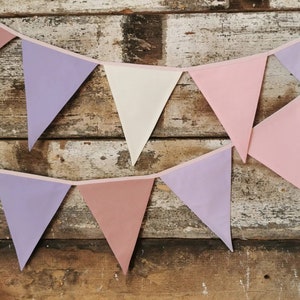 Wall decor will be great accessorie for kids party, baby shower and nursery. Bunting banner made of 100% pure cotton. Triangles are sewn double layer and are handmade. Old pink, violet, off white color. In one metre are 6 pieces of fabric flags.