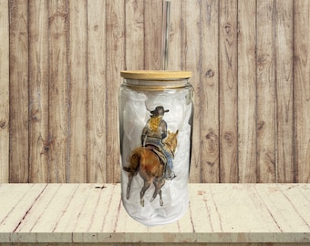 16oz Glass Cow girl riding a horse tumbler. With bamboo lid and plastic straw.