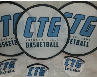May include: Five round, white, hand-held fans with black trim. The fans have a blue logo that says "CTG Change the Game Basketball".