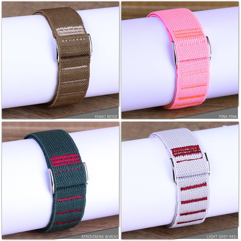 May include: Four different colored elastic watch bands with contrasting colored stripes. The bands are khaki beige, pink pink, dark green with red stripes, and light gray with red stripes.