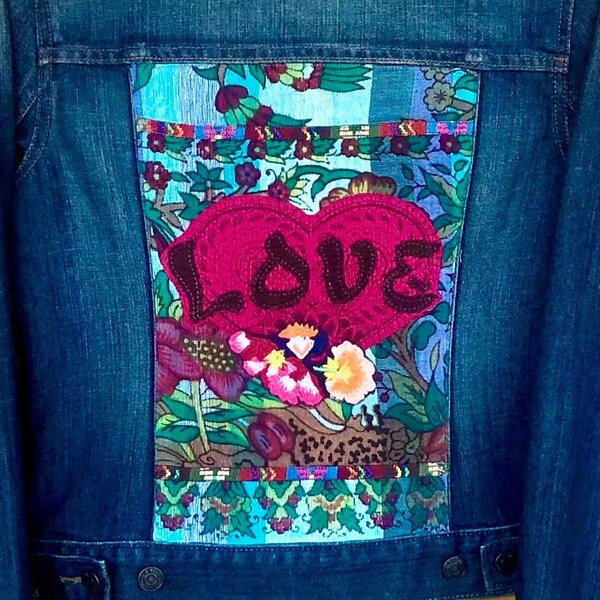 Woman's size M denim jacket with pink heart LOVE applique and floral embroidery on colorful aqua tapestry fabric and woven braid trim