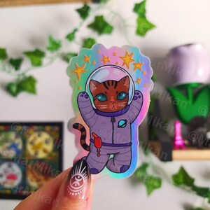 Pegatina vinilo holográfico gato astronauta espacial // Adesivo in vinile olografico impermeabile carino spazio gatto astronauta