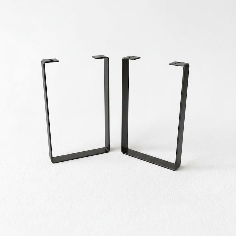 two black metal brackets with a simple, minimalist design.