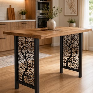 May include: A rectangular kitchen island table with a thick natural wood grain top and two black metal side panels featuring an intricate laser-cut tree branch design. The table stands on four straight legs and supports a light-colored ceramic vase.