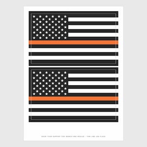 May include: Two black and white American flag decals with a thin orange stripe across the middle. The text below the flags reads "Show your support for Search and Rescue - Thin Line USA Flags".