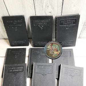 May include: A collection of nine black hardcover books with gold lettering. The books are titled "Steam Engines and Valve Gears", "Mechanical Drawing", "Geometrical Drawing", "Heat and Steam", "Steam Heating Systems", "Formulas and Root Arithmetic", "AC Motor Rewinding and Reconecting", "Steam Turbines and Condensers", and "Mechanical Principles". All books are published by the International Textbook Company, Scranton, PA.