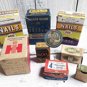 May include: Vintage boxes of nails, tacks, staples, and pins. The boxes are made of cardboard and have various colors and designs. Some of the boxes have the brand names "Parker-Kalon", "DSS", "Tower Brand", and "Superior".