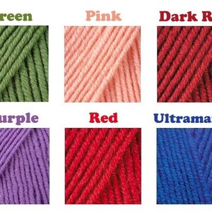 May include: A collection of yarn skeins in various colors, including orange, green, pink, dark red, turquoise, blue, purple, red, ultramarine, and coral.