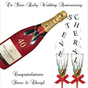 May include: A red and gold bottle of Moët & Chandon champagne with a red glitter finish. The bottle is labelled with the number 40. Two champagne flutes with colourful designs are shown with red bows. The text "To Our Wonderful Friends On Your Ruby Wedding Anniversary" is written at the top of the card. The text "Congratulations Steve & Cheryl 16/02/2025" is written at the bottom of the card.