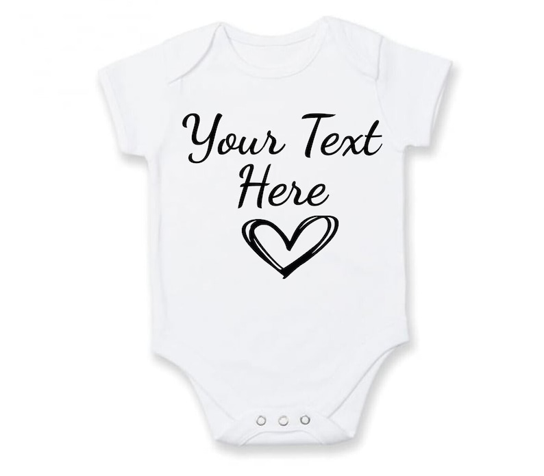 A personalised baby vest in white available in short or long sleeves. Customised text can be applied making it tailored to meet your needs for any occasion. Unique heart icon applied which the design can be applied in any colour of your choice.