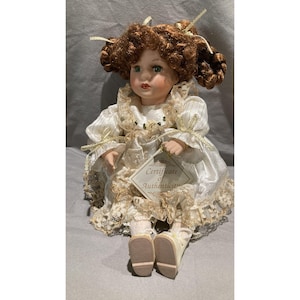 collectors choice Genuine Fine Bisque Porcelain wind up  Doll - White/ Gold