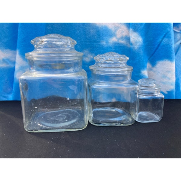 set of 3 , glass square apothecary jars with starburst lids