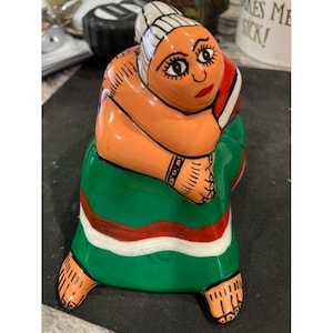 ceramic sitting woman figurine