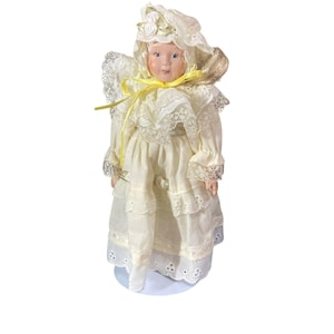 vintage 8&#39;&#39; porcelain doll with stand , made in china, yellow dress