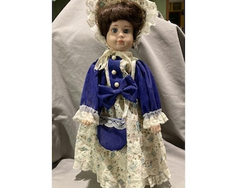 15'' vintage porcelain doll, blue floral dress and bonnet