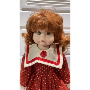 15&#39;&#39; porcelain doll, red hair, green eyes, and red dress, vintage