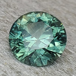 1.18 ct Montana sapphire. Round brilliant ready for the setting of your choosing. More rare than a diamond. Vivid alpine green sapphire.