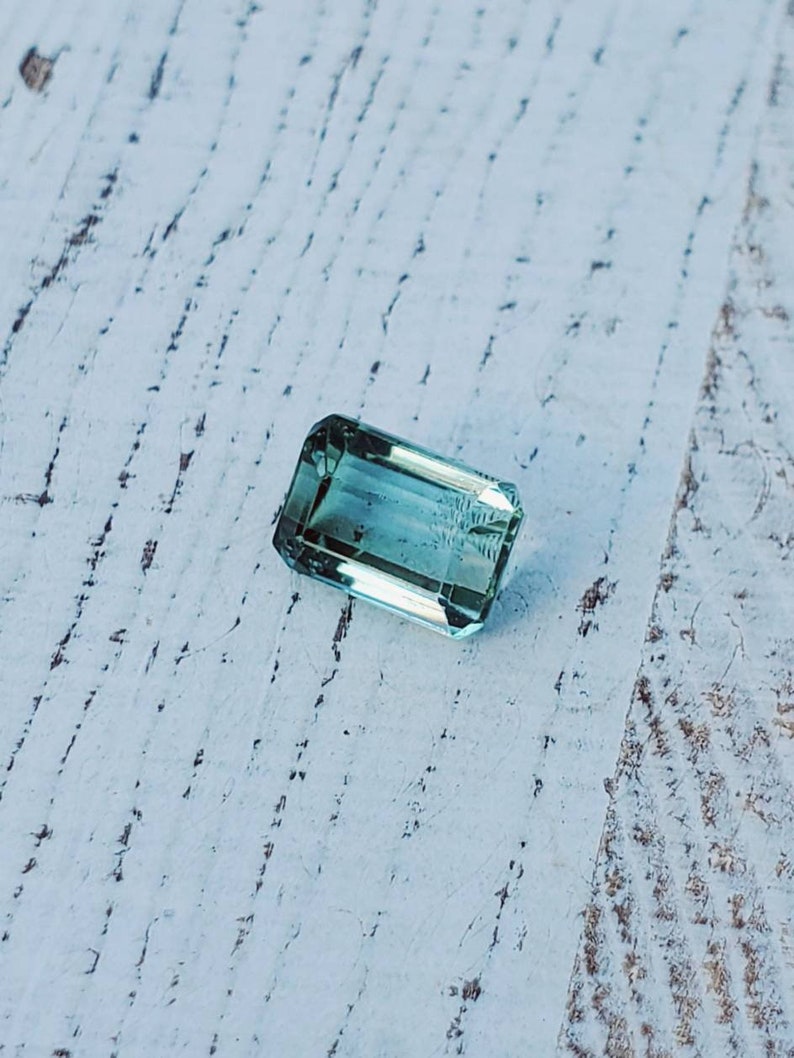 Unique gemstone 2 carats Very clean Beautiful luster Natural greenish-blue tourmaline Great for jewelry or your gem collection.
