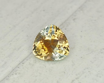 0.80 Carat Orange Montana Sapphire: Trillion Cut Gemstone