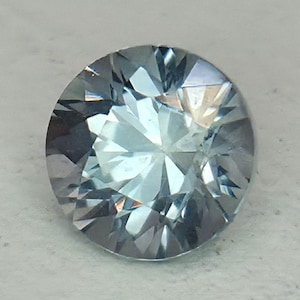 VVS Light Teal Montana Sapphire: 0.7 ct Round Cut Gemstone