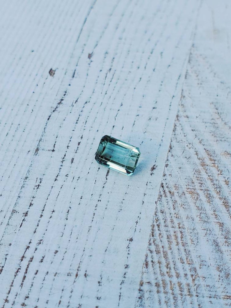 Unique gemstone 2 carats Very clean Beautiful luster Natural greenish-blue tourmaline Great for jewelry or your gem collection.