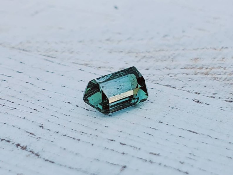 Unique gemstone 2 carats Very clean Beautiful luster Natural greenish-blue tourmaline Great for jewelry or your gem collection.