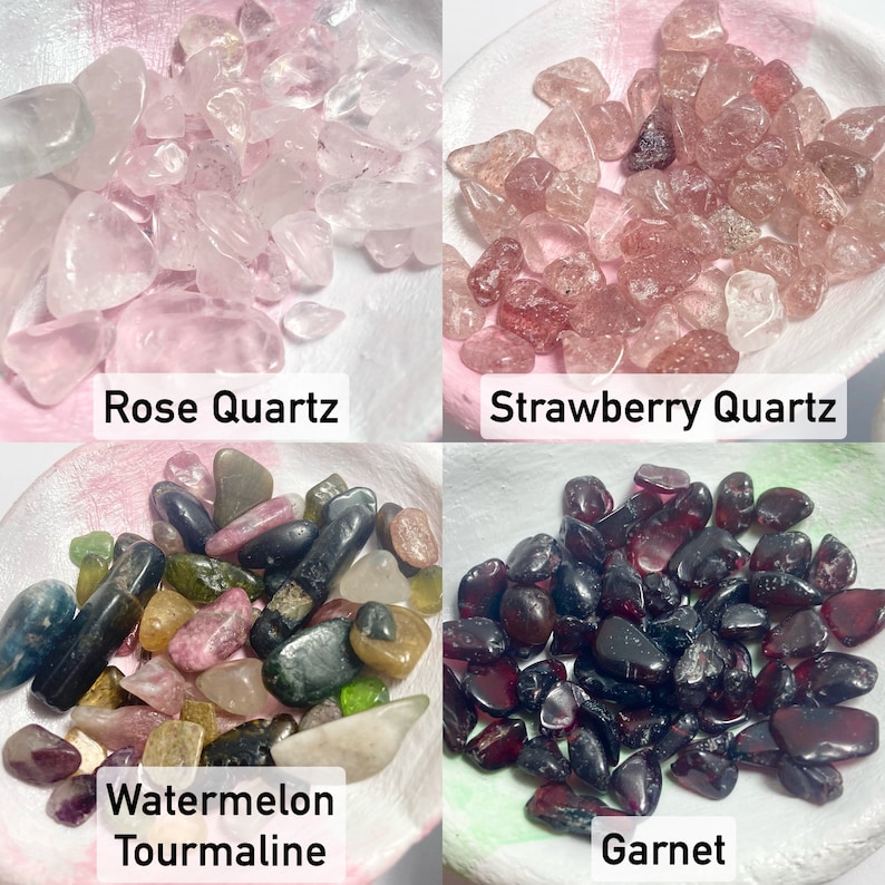 a view of our crystals: rose quartz a clear to pale pink stone, strawberry quartz a pale to deep speckled pink stone. watermelon tourmaline ranges with beautiful shades of green, pink, yellow, and more! our garnet is a deep red shade.