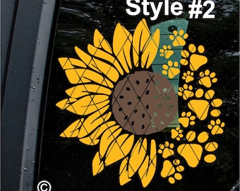 May include: A yellow sunflower with a brown center is surrounded by a circle of yellow paw prints. The text "Style #2" is above the sunflower.