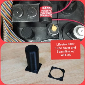 May include: A black cylindrical filler tube cover and beam line component with visible weld textures. The set includes a tall cylinder on a square base and a separate square frame. Text on the image reads: Lifesize Filler Tube cover and Beam line w/ WELDS.