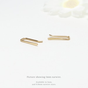 May include: Two gold ear wires, one straight and one curved, on a white background. Picture showing 1mm earwire. Available in 1mm and 0.8mm earwire sizes.