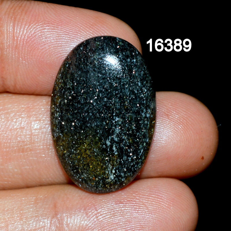 Black gemstone with gold cheap flecks