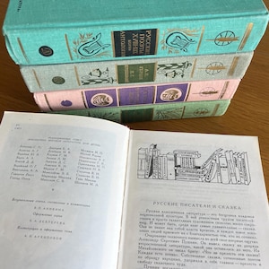 May include: A stack of four vintage hardback books with a teal, pink, and green colour scheme. The top book has the title "Russian Poetry Anthology" in gold lettering. The bottom book is open to a page with a list of authors and a black and white illustration of a bookshelf filled with books.