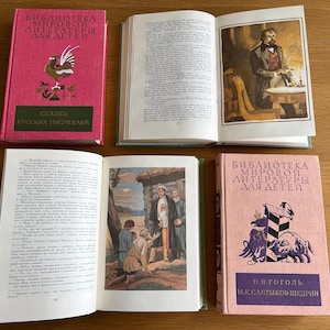 May include: A set of four vintage hardback books with pink and green covers. The books are titled "Bibliotheca Mirovoi Literatury Dlya Detey" and feature illustrations of a rooster, a man in a suit, a group of people in a village, and a pig. The books are in Russian.