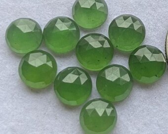 May include: A collection of ten faceted, round gemstones in a vibrant, light green hue. The gemstones have a polished, reflective surface, and are arranged closely together. These gemstones are suitable for jewelry making.