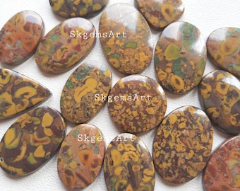 May include: A collection of 14 oval-shaped, polished, natural, brown, yellow, and green jasper stones. The stones have a mottled, marbled, and speckled pattern.