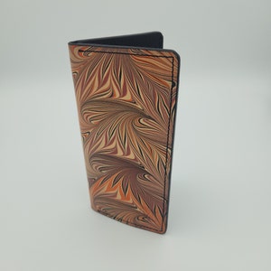 Cartera alta de piel jaspeada