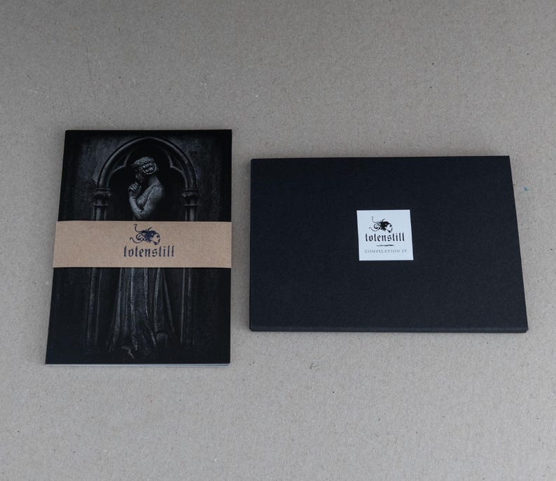 May include: Black and white image of a woman in a gothic setting. The image is printed on a card with a brown paper label that reads "totenstill".