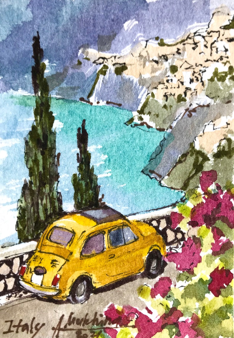 May include: A watercolor painting of a yellow Fiat car parked on a cliff overlooking a turquoise blue ocean. The car is surrounded by green trees and pink flowers. The painting is signed "Italy" in the bottom left corner.